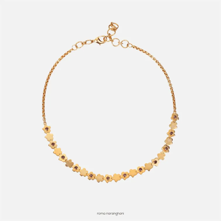 Roma Narsinghani Daisy Choker Choker The piece is set in brass, hand set with swarvoski in 18KT gold finesse. Each piece is unique and handcrafted by our artisans. RNLOVE14